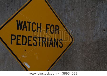 watch for pedestrians diamond caution warning sign
