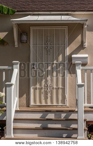House Entrance Door Behind The Grid With The Juliet Style Awing
