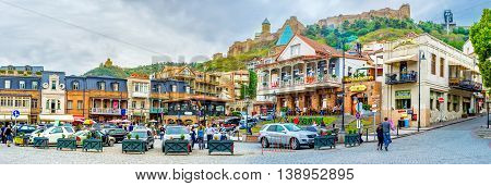 TBILISI GEORGIA - MAY 28 2016: The pleasant walk along Vakhtang Gorgasali Square with the view on the cozy cafes wine houses and family hotels on May 28 in Tbilisi.