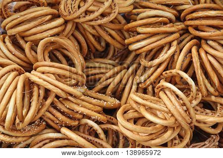 Background of a large number of spilling bread-ring. Food