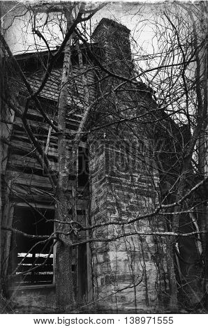 Chimney of abandoned house in Appalachia with overgrown vines, Chilhowie, Virginia