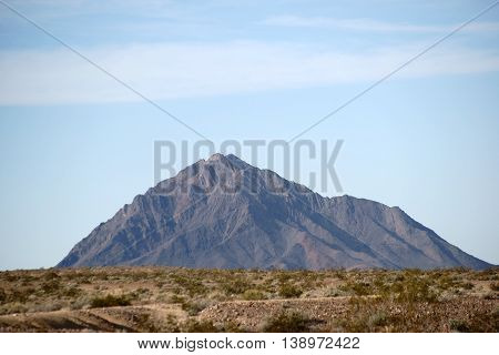 The portrait of a black mountain between the Death Valley crossing and the city Amargosa Valley.