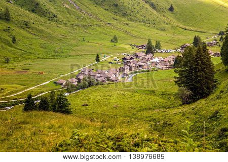Clouds Cover Village On A Mountaing View (ponte Di Legno, Case Di Viso - Italy)
