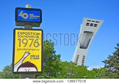 MONTREAL QUEBEC CANADA 06 15 16: Montreal olympic 40th anniversary expo sign and the olympic stadium tower the tallest inclined tower in the world.