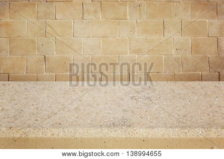 Background with concrete table and stone wall for product montage