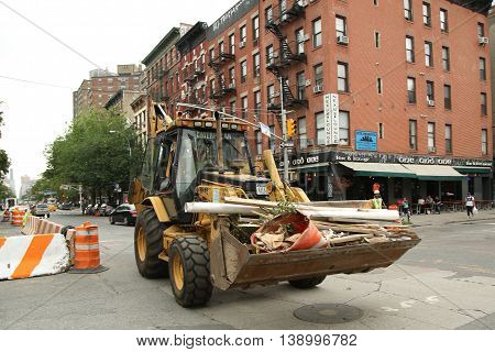 NEW YORK - JUNE 16, 2016: Constriction workers repair street in Lower Manhattan