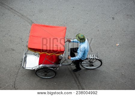 Cyclo Or Pedicab Driver On Hanoi Street