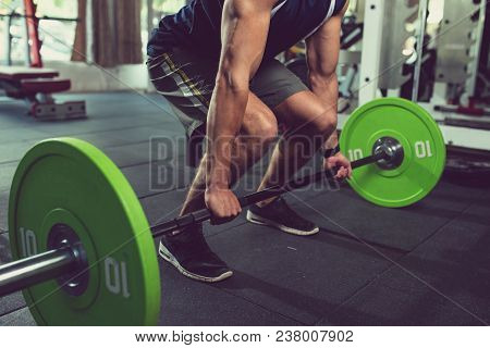 Cropped Image Of Sportsman Practicing Deadlift With Heavy Weight