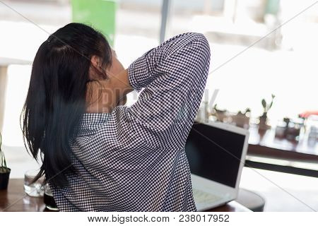 Businesswoman Working Hard Until Neck Pain In The Coffee Shop