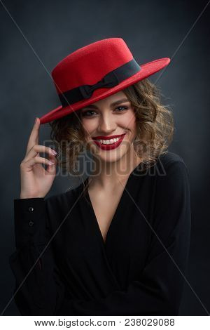 Portrait Of Beatiful Girl With Wonderful Smile, Wering Red Lipstick And Fashionable Red Hat. Model H