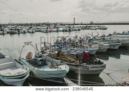 March 24th, 2018 - Olhao, Portugal: Fisherman Working And Repairfisherman Working And Repairing Nets