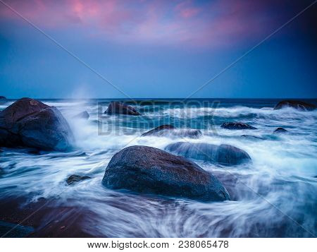 Rocks Frolic In The Tide At Sunset On A Beach In Yangyang, South Korea.
