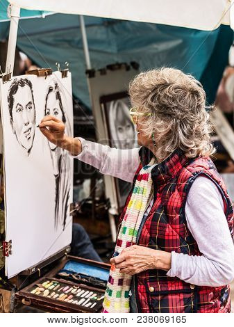 Paris, France - July 06, 2017: The Painter Works At The Open Air Artist Market At The Tertre Square 