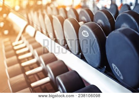 Rows Of Dumbbells In The Gym With Hign Contrast And Monochrome Color Tone