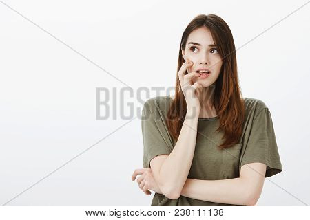 Girl Got Interesting Idea, Wanting To Fullfill It. Portrait Of Focused Intrigued Good-looking Woman 