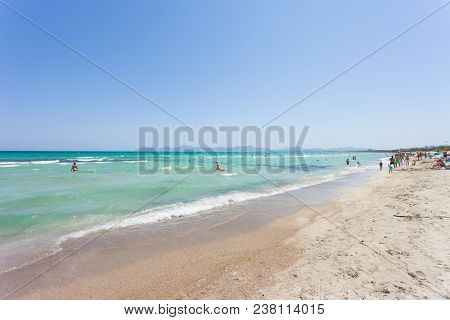 Platja De Muro, Mallorca - August 2016 - Tourists Enjoying Their Vacations At The Beach Of Ca'n Pica