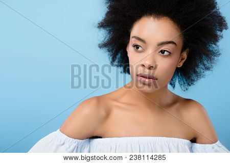 Close-up Portrait Of African American Woman In Stylish Off-the-shoulder Top Isolated On Blue