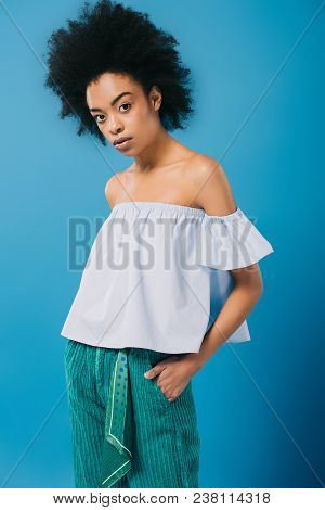Young African American Woman In Stylish Off-the-shoulder Top Isolated On Blue