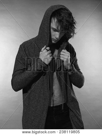 Man Portrait. Beautiful Young Guy In Hood, Nude Torso With Navel, Long Forelock, Quiff. Black And Wh