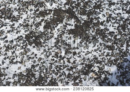The Texture Of The Winter Asphalt With Snow. Winter Mottled Background