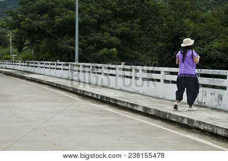 Asian Thai Women Traveler Walking Bridge Road Crossover Ping River And Looking View Bhumibol Dam And