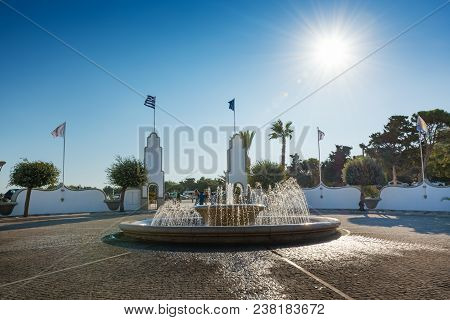 People Behind Water Fountain In Kalithea (rhodes, Greece)