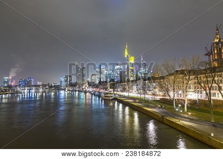 Skyline Of Frankfurt By Night With River Main