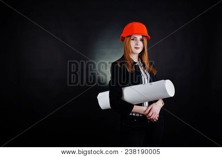 Engineer Woman In Orange Protect Helmet With Construction Paper Projekt.