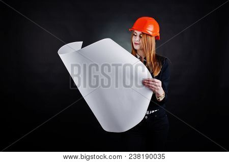 Engineer Woman In Orange Protect Helmet With Construction Paper Projekt.