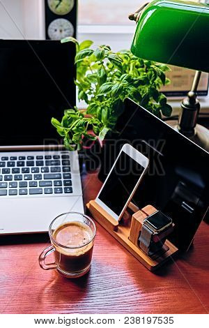Communication Set With Smart Watch, Tablet Pc, Computer And A Cup Of Coffee On A Table.