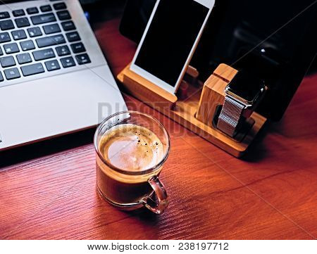 Communication Set With Smart Watch, Tablet Pc, Computer And A Cup Of Coffee On A Table.