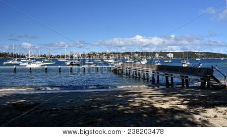 Balgowlah, Australia - Feb 4, 2018. Kids Playing At The Jetty. Yachts In North Harbour At Fourty Bas