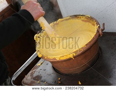 Hadn Of The Cook During The Preparation Of Polenta A Typical Dish Of The Culinary Tradition Of North