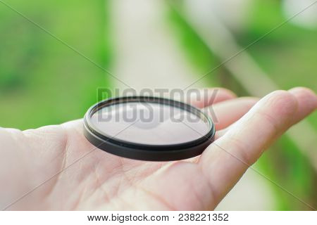 Protective Filter For The Lens Photographer Is Holding A Uv Filter