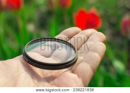 Protective Filter For The Lens Photographer Is Holding A Uv Filter
