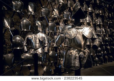 London, UK - 7th June 2017: Suits of armour and a display of breastplates in the Armoury of the Tower of London.