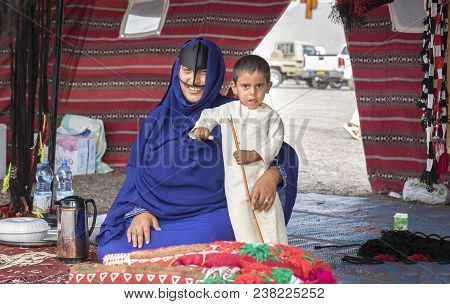 Ibri, Oman, 28th April 2018: Bedouin Woman With Her Kid In A Tent