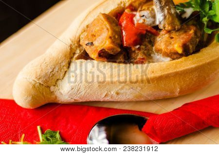 Goulash With Large Pieces Of Meat And Vegetables, All Served In Bread