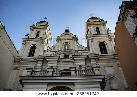 Catholic Church Building Against The Sky With The Moon