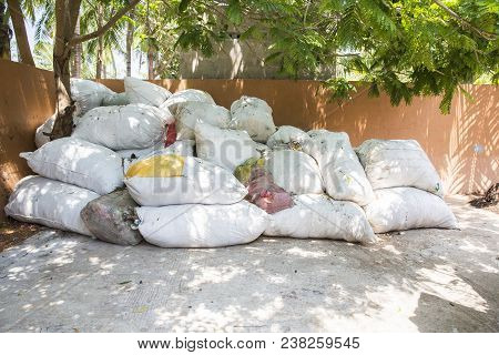Big Bags Of Waste Plastic Bottles And Other Types Of Plastic Waste At The Waste Disposal Site. Waste