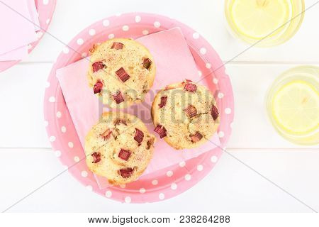 Fresh Homemade Rhubarb Yogurt Muffins Sprinkled With Cinnamon And Sugar On Pink Plate And Napkin, Gl