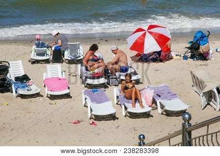 Zelenogradsk, Kaliningrad Region, Russia - July 29, 2017: Unknown People Resting On A Sandy Beach On