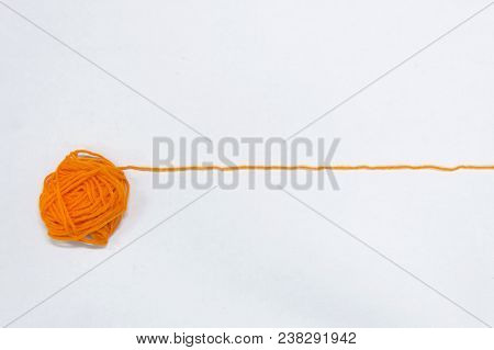One Yarn Orange Knit The Draw Is Straigh, The Material Used In Knitting Clothing, White Background.