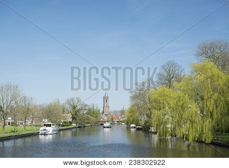 Loenen, Netherlands, 18 April 2018: Boats And Church Tower In River Vecht Near Loenen In Dutch Provi