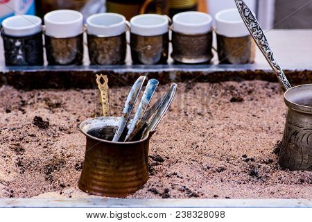 Equipment For Preparing Turkish Coffee Made On The Brown Sand
