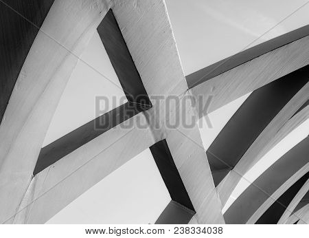Abstract Steel Structure Combining Strong Metal Elements To Form A Large Asymmetrical Lattice.