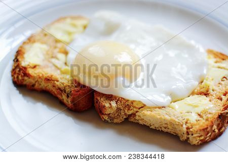 The Perfect Poached Egg On Seeded Buttered Brown Toast