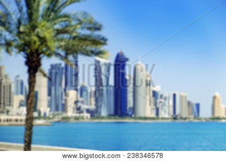 Abstract Blurred Bokeh Skyscrapers Of Doha From The Persian Gulf. Futuristic Skyline In The Financia