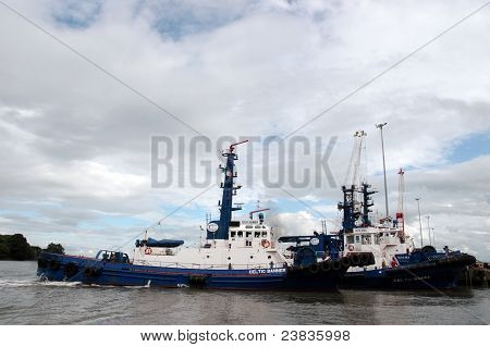 Celtic Rebel And Banner River Shannon Tug Boats Docking