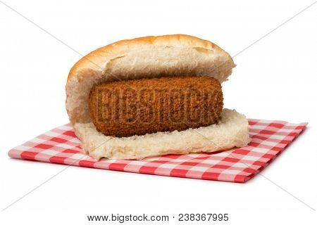 Traditional white bun with a Dutch kroket, called broodje kroket isolated on white background